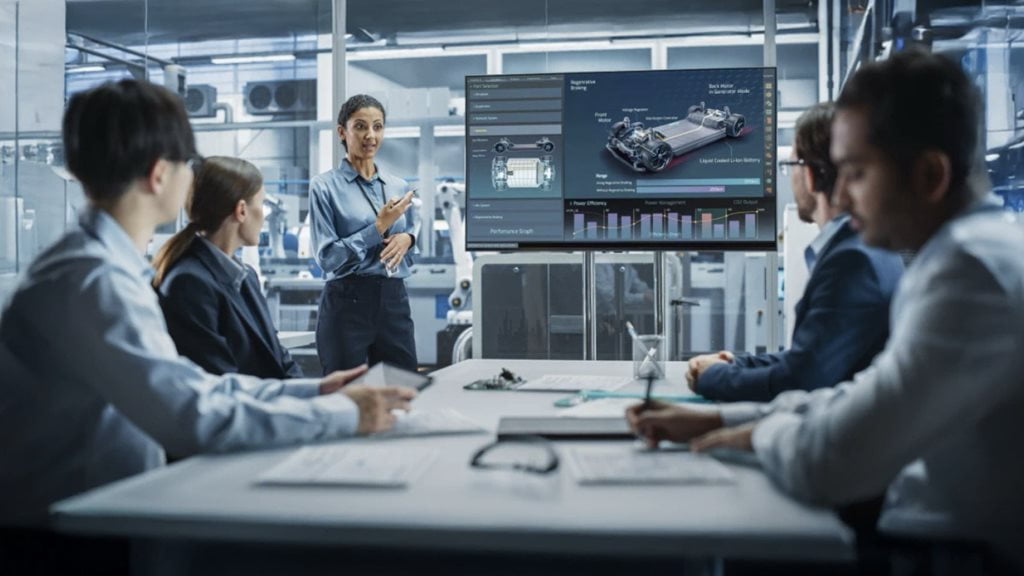 Engineer presenting EV design to colleagues