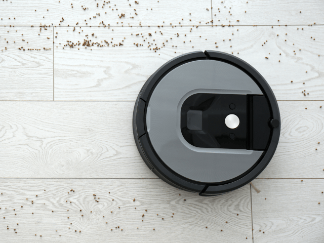 Vacuum robot cleaning the dirty floor.